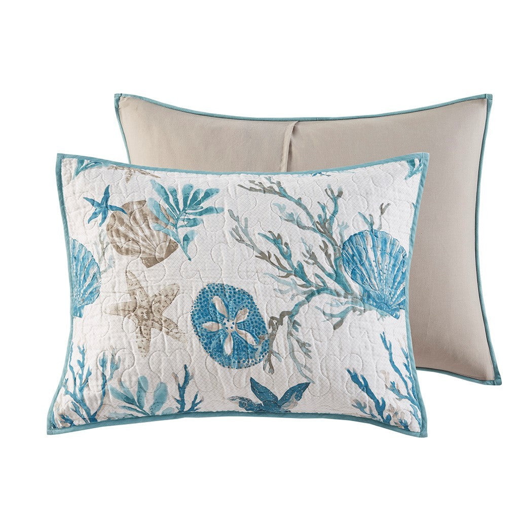 Coastal decorative pillows in aqua with seashell and starfish print and teal piping on Tampa Home & Garden Store