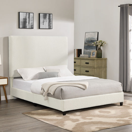 Upholstered platform bed with tall white headboard and dark tapered legs on Tampa Home & Garden Store
