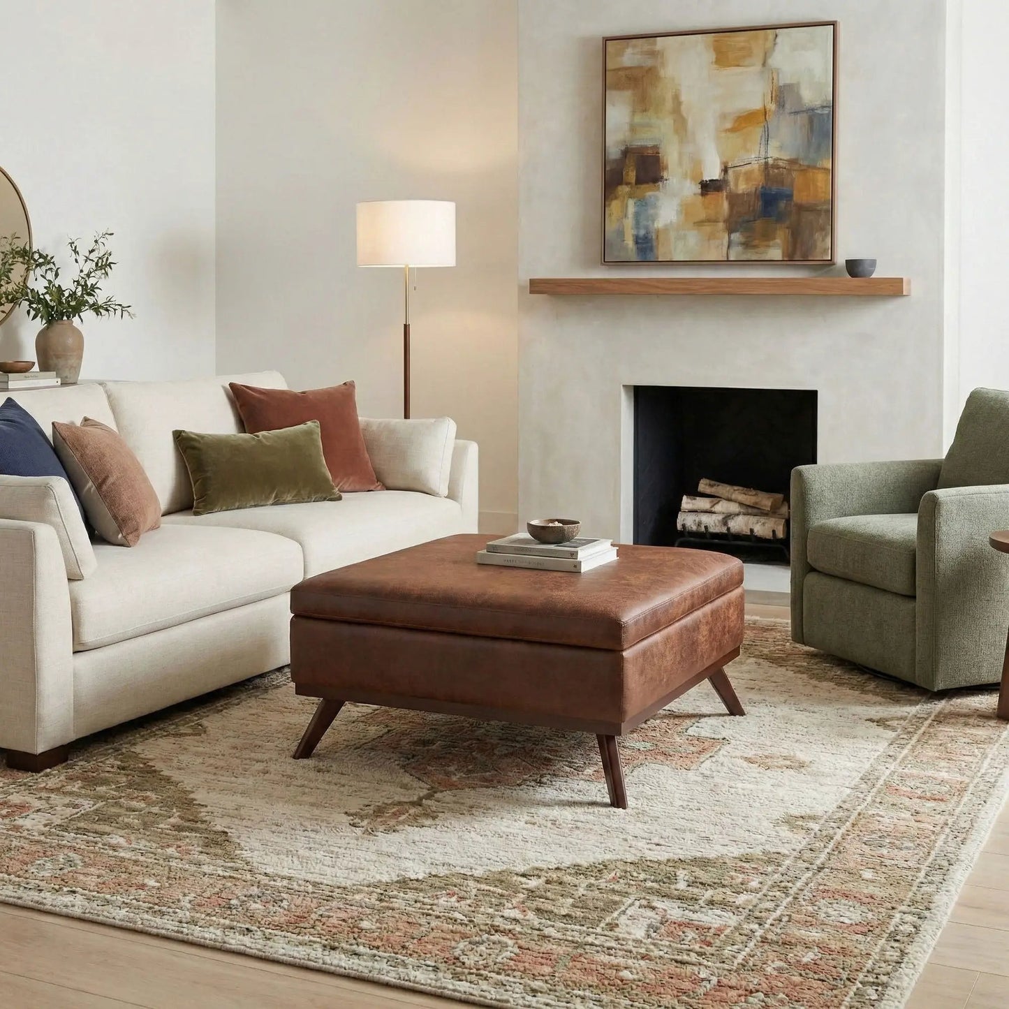 Owen square coffee table storage ottoman in brown leather with angled legs in a cozy living room on Tampa Home & Garden Store