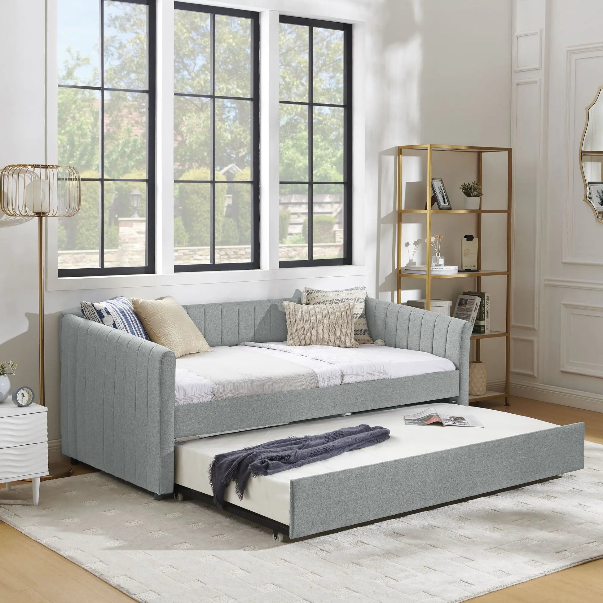 Upholstered daybed with vertical stripes and a pull-out trundle in blue-gray fabric on Tampa Home & Garden Store