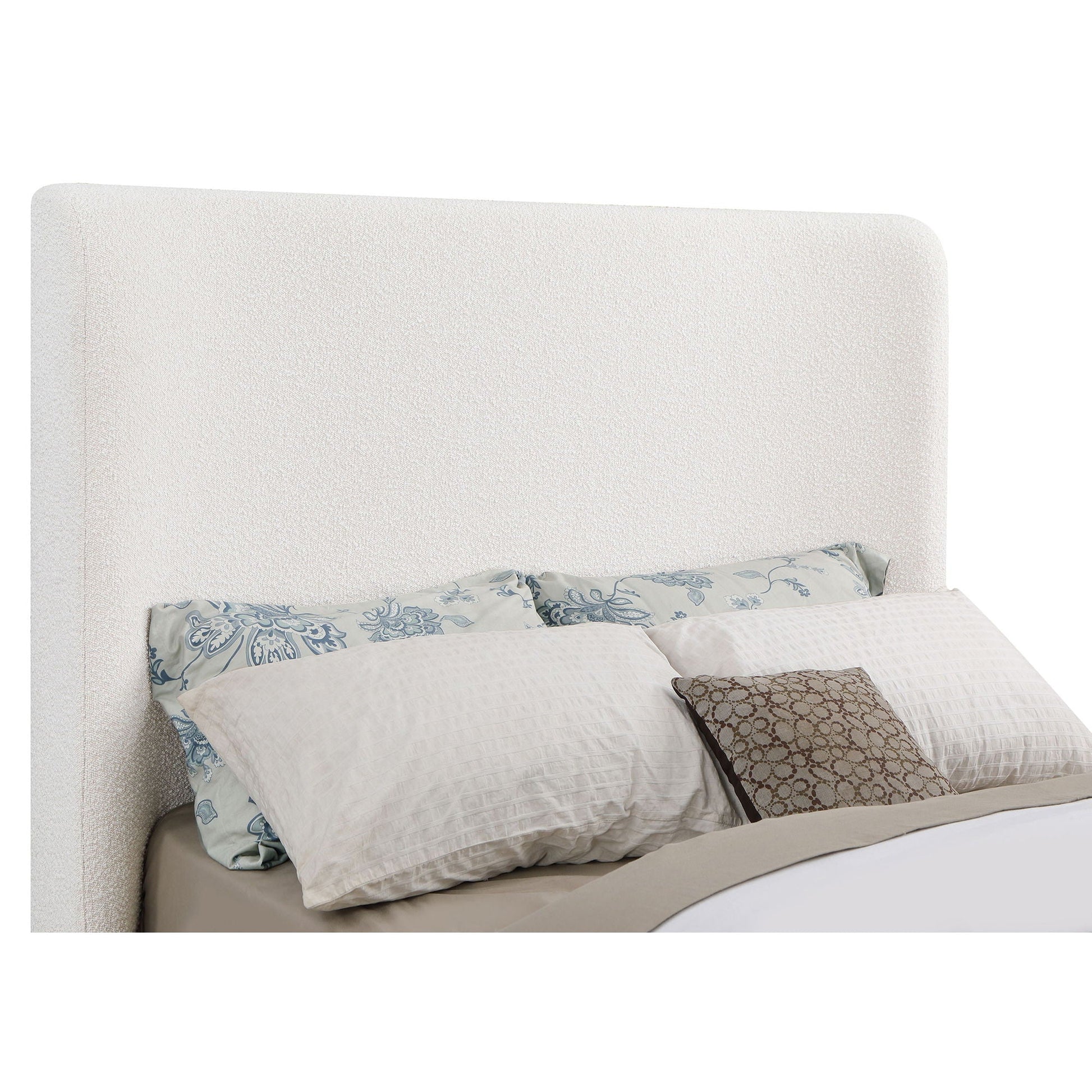 HouseOfZazla Vindra queen sleigh bed cream upholstery with blue floral pillows on Tampa Home & Garden Store
