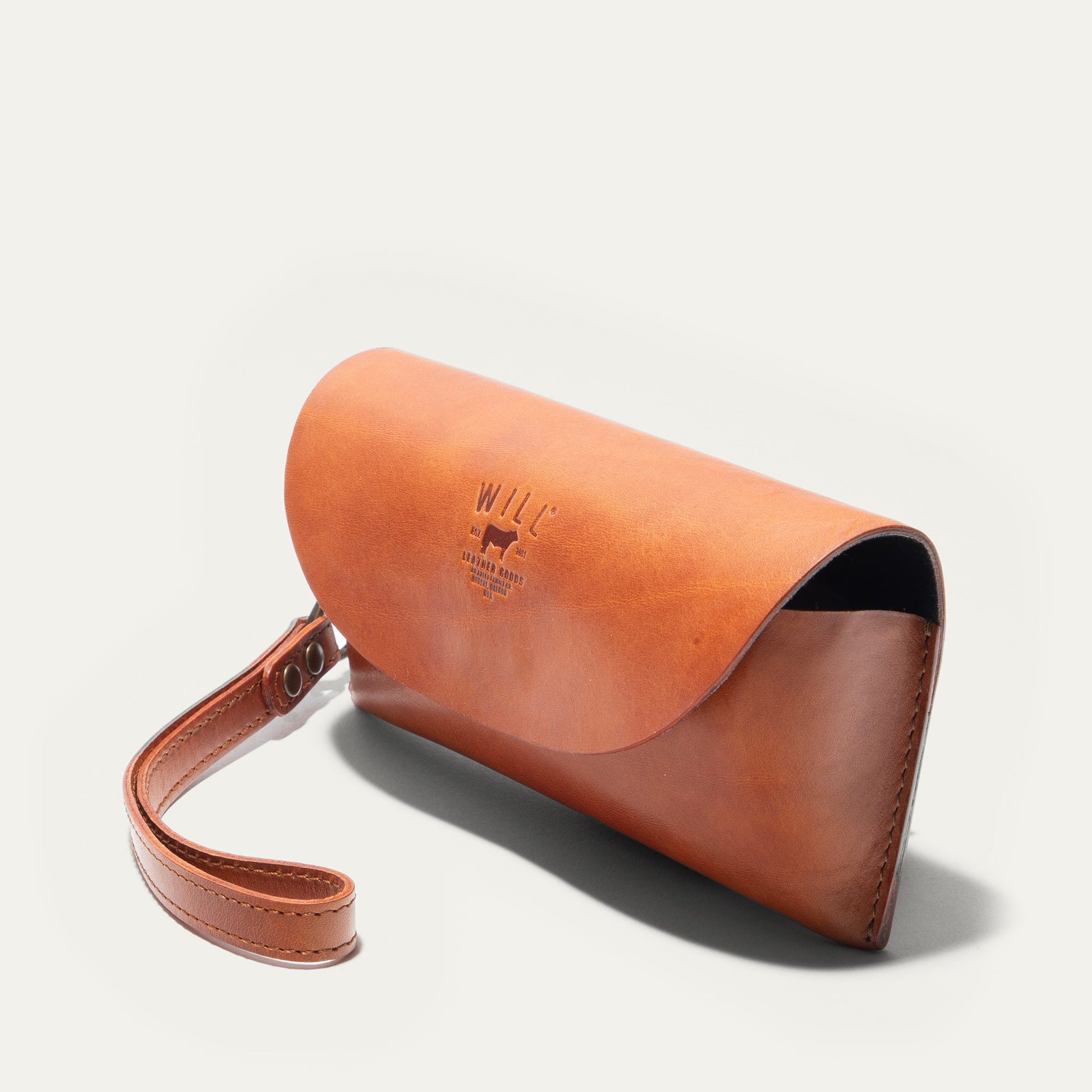 Eyeglass case by Will Leather Goods, tan leather with embossed logo and leather strap on Tampa Home & Garden Store