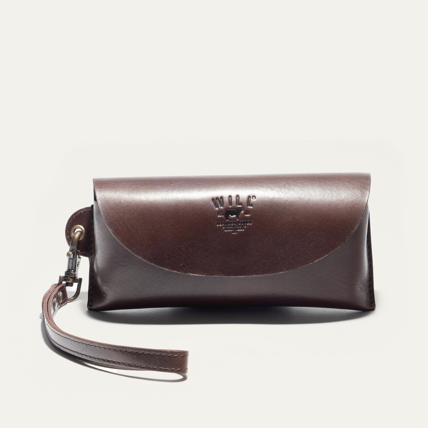 Eyeglass case by Will Leather Goods in brown leather with embossed logo and strap on Tampa Home & Garden Store