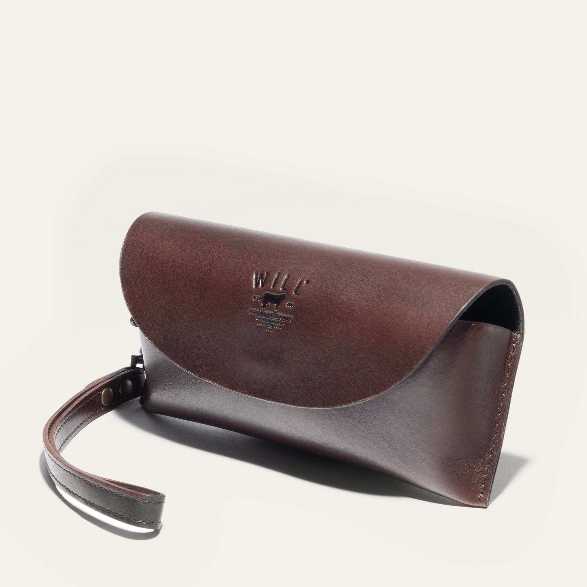 The Eyeglass Case in brown leather with Will Leather Goods embossing on Tampa Home & Garden Store