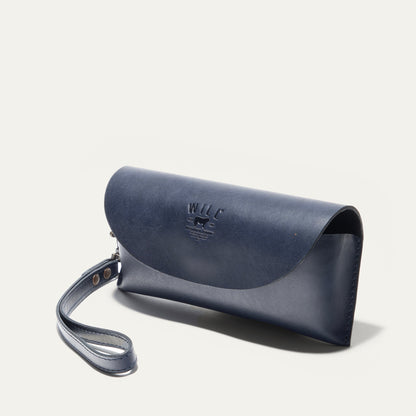 The Eyeglass Case by Will Leather Goods in navy leather with a light blue strap on Tampa Home & Garden Store