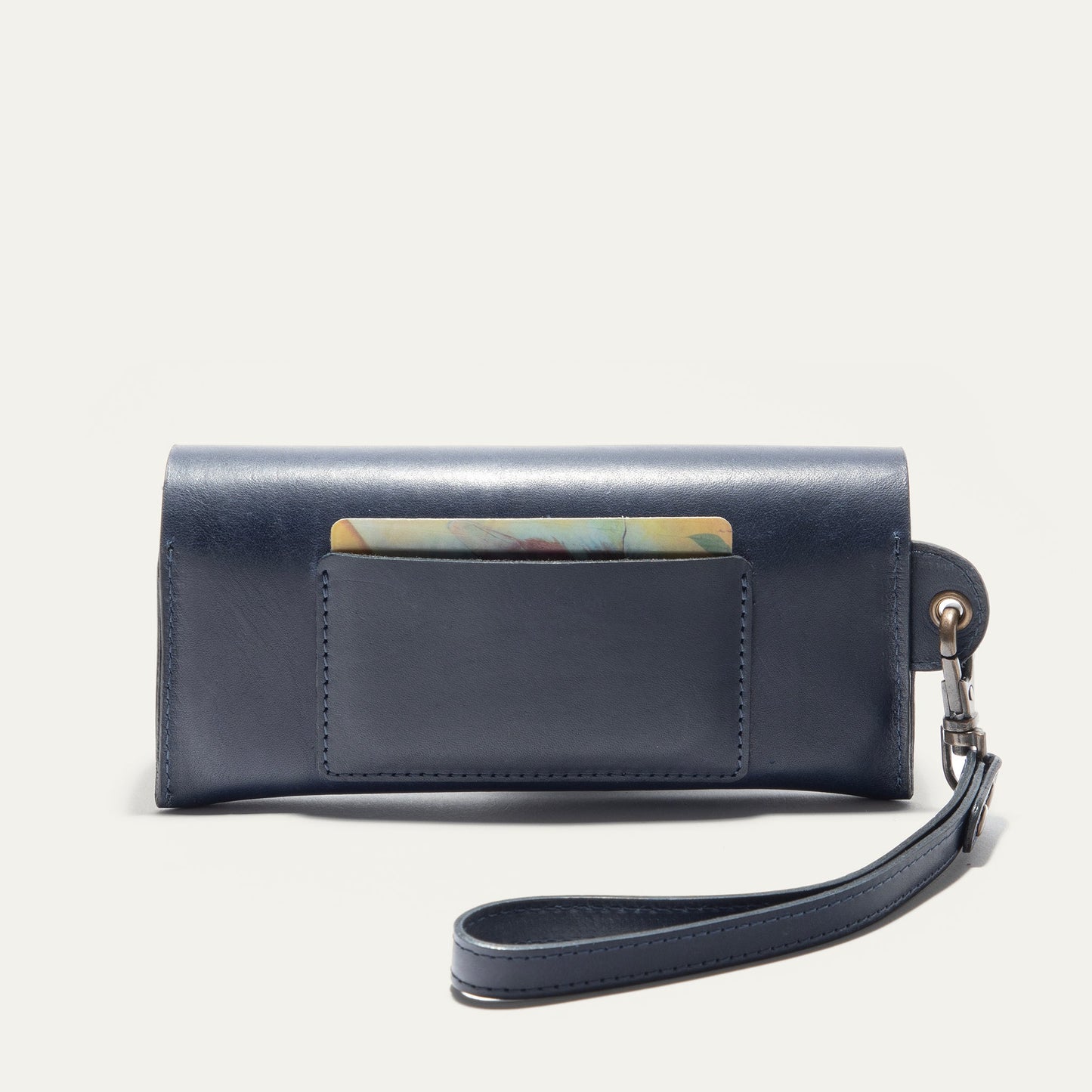 The Eyeglass Case in navy blue leather with stitching and a strap by Will Leather Goods on Tampa Home & Garden Store