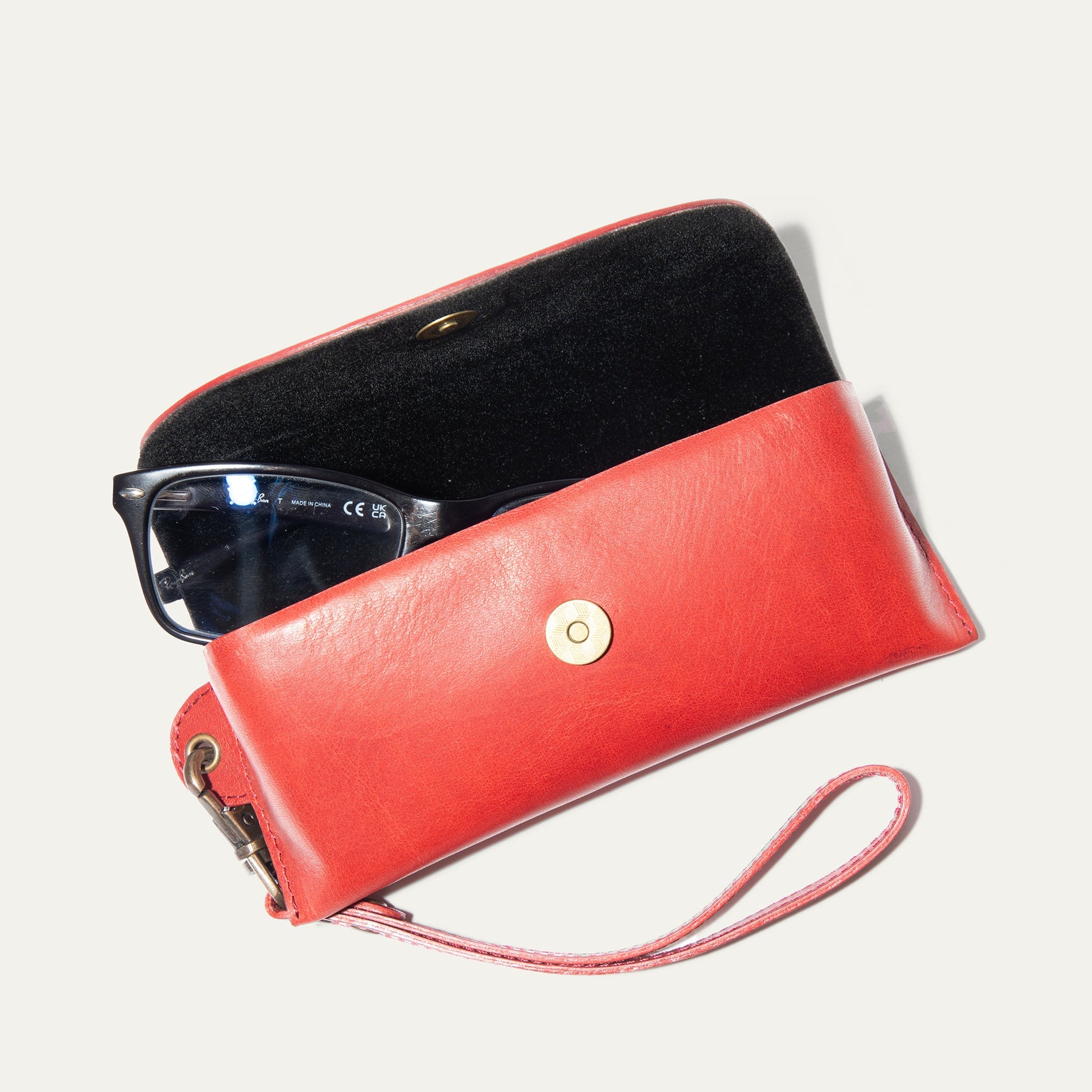 The Eyeglass Case by Will Leather Goods, red leather exterior, black interior with gold hardware on Tampa Home & Garden Store