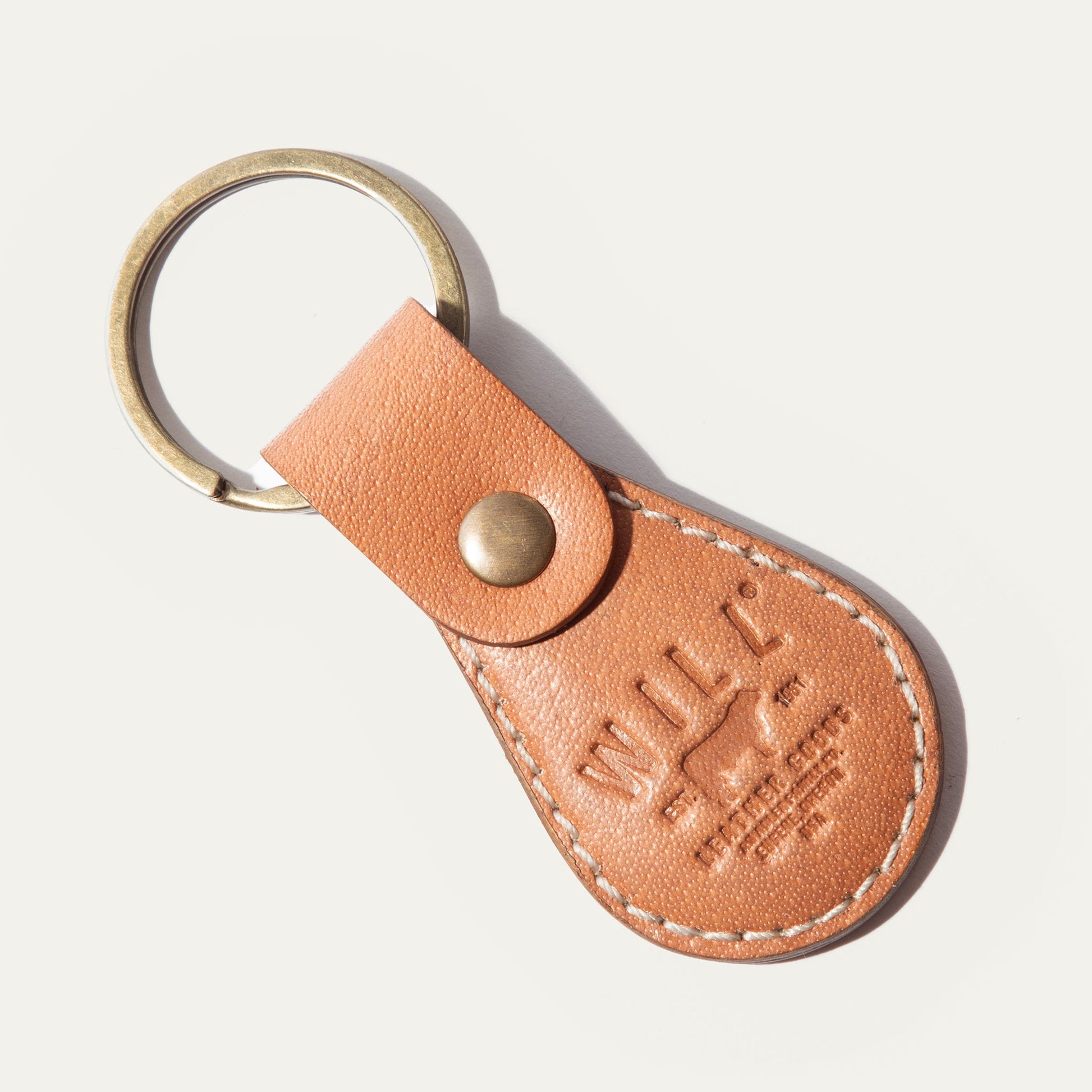 Logo Keychain by Will Leather Goods in tan leather with brass ring and stitched strap on Tampa Home & Garden Store
