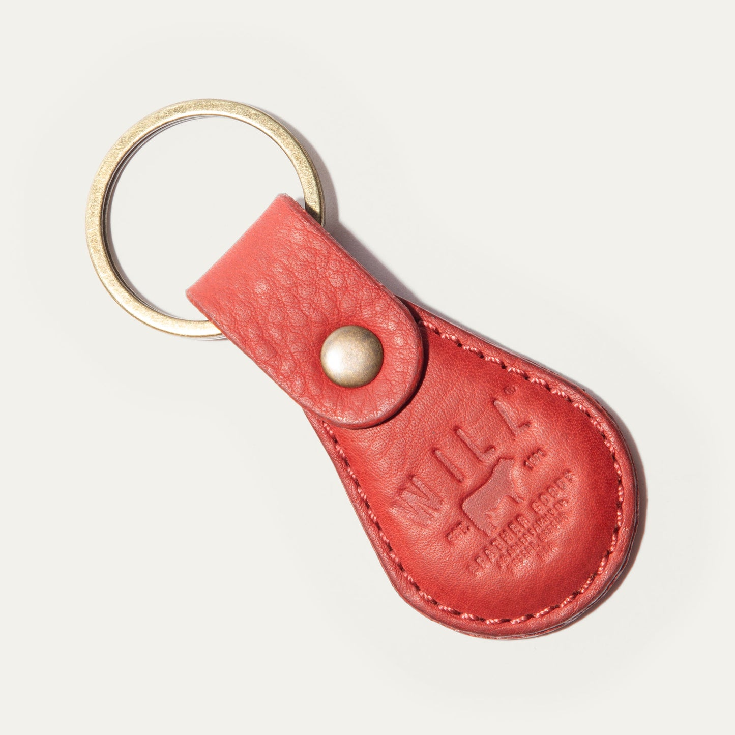 Logo keychain in red leather with brass ring and stitched strap by Will Leather Goods on Tampa Home & Garden Store
