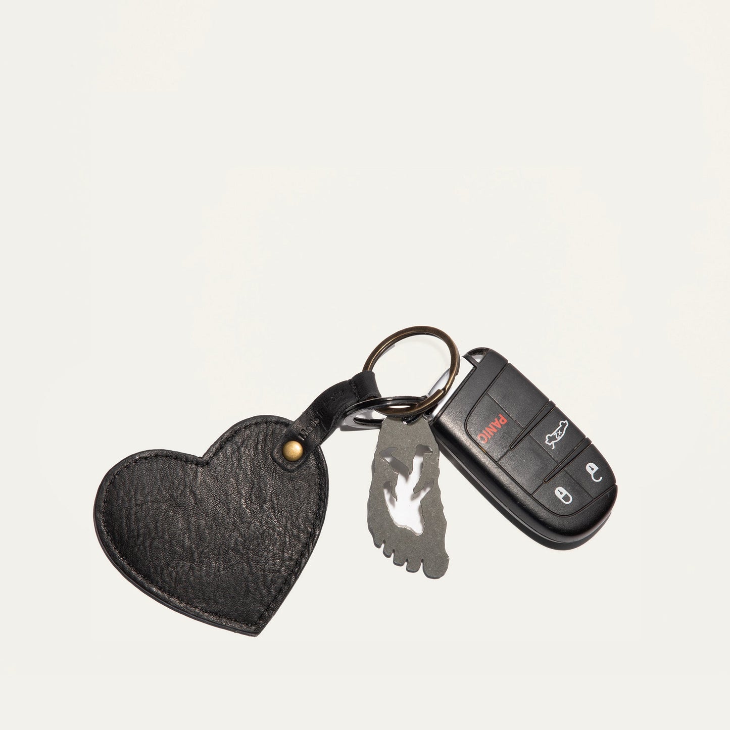 Heart keychain by Will Leather Goods, black leather with brass rivet, attached to keys and fob on Tampa Home & Garden Store