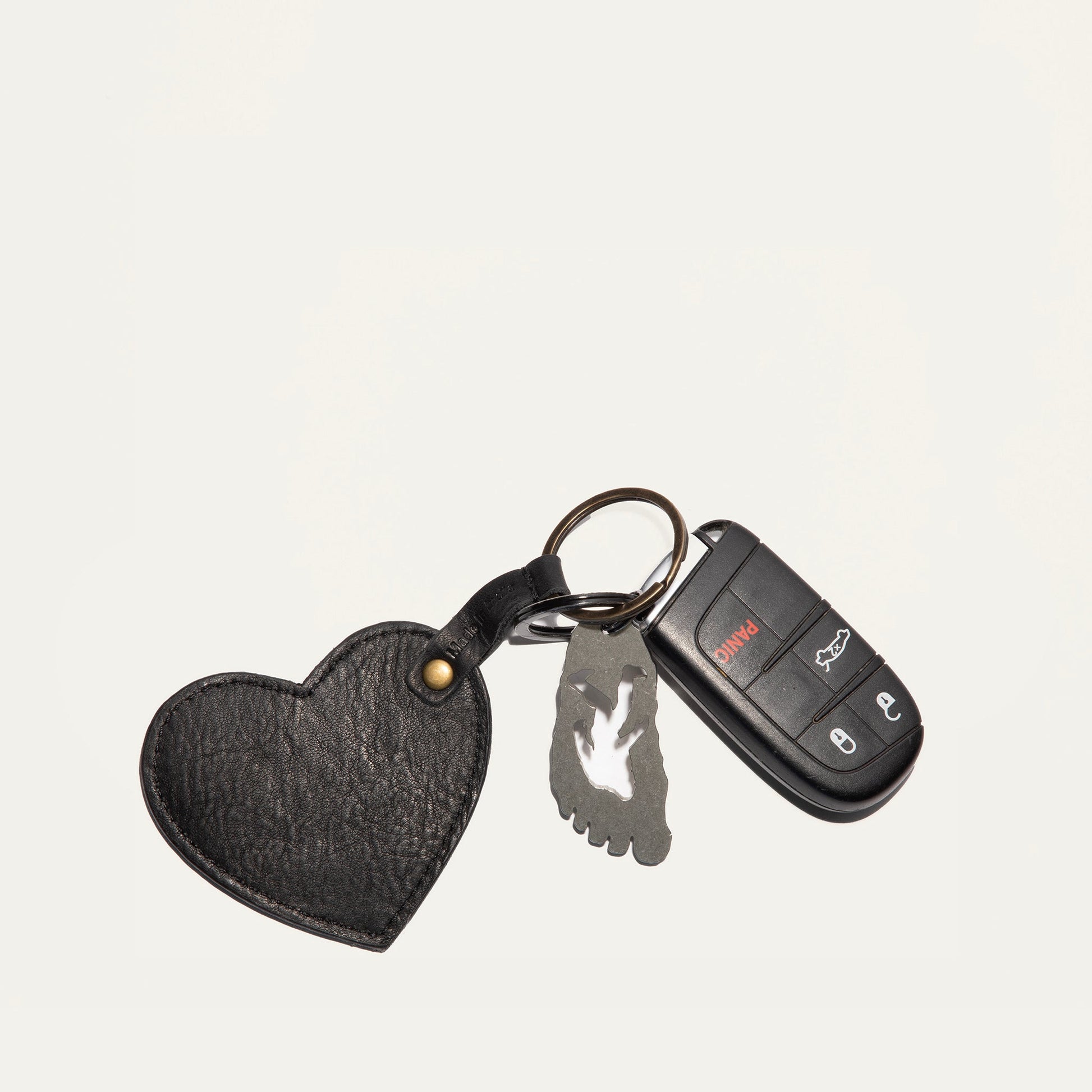 Heart keychain by Will Leather Goods, black leather with brass rivet, attached to keys and fob on Tampa Home & Garden Store