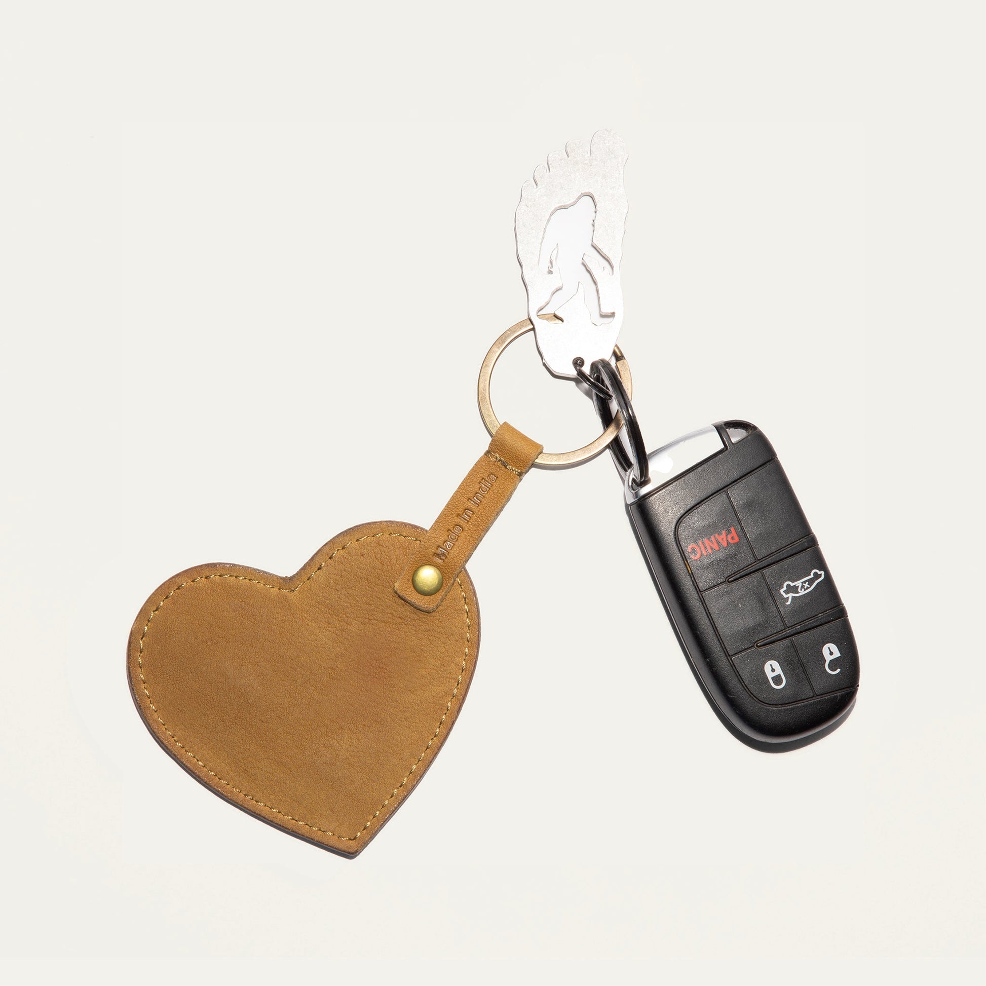 Heart keychain by Will Leather Goods with brown leather heart and cutout figure on keyring on Tampa Home & Garden Store