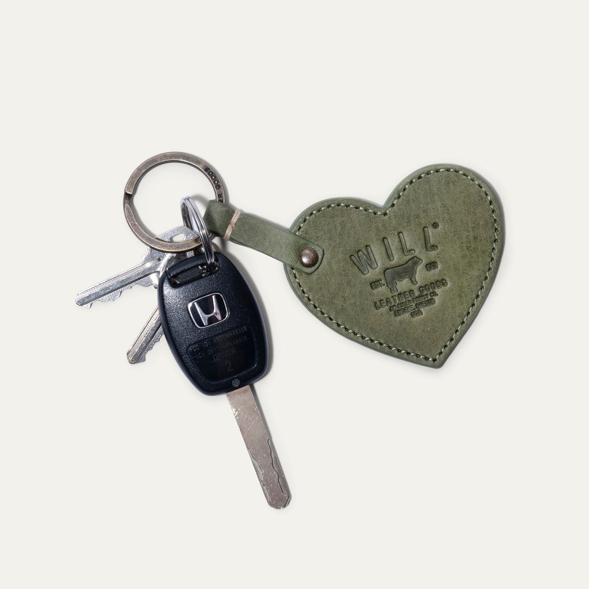Heart-shaped olive green leather keychain by Will Leather Goods on Tampa Home & Garden Store