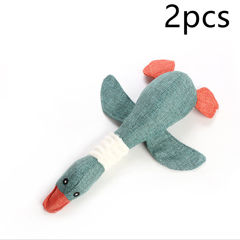 2pcs teal fish-shaped plush dog toys with orange fins and white ribbed midsection on Tampa Home & Garden Store