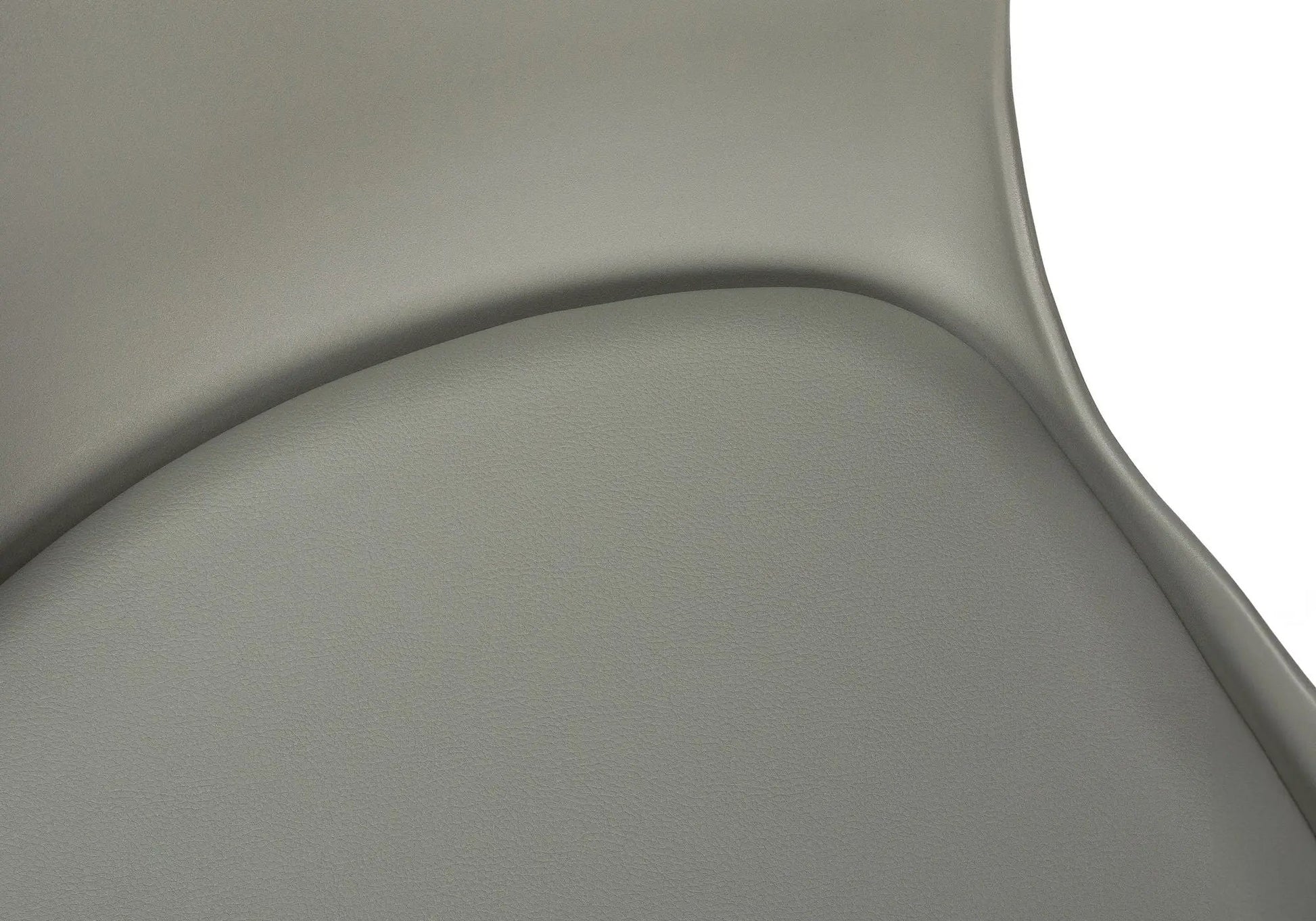 Office chair seat in gray pebbled leather with curved seam detail on Tampa Home & Garden Store