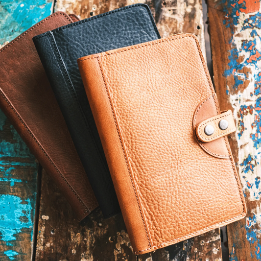Three Will Leather Goods medium leather journal covers with card slots in tan, black, and brown on Tampa Home & Garden Store