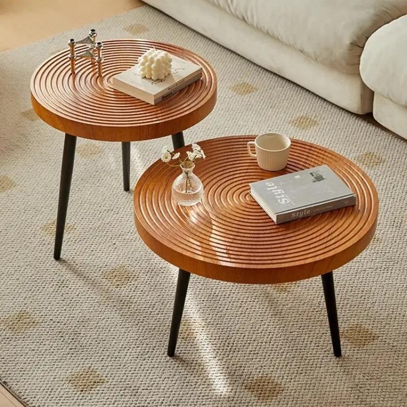 Japanese-style growth-ring coffee tables, warm brown solid wood with black legs on Tampa Home & Garden Store