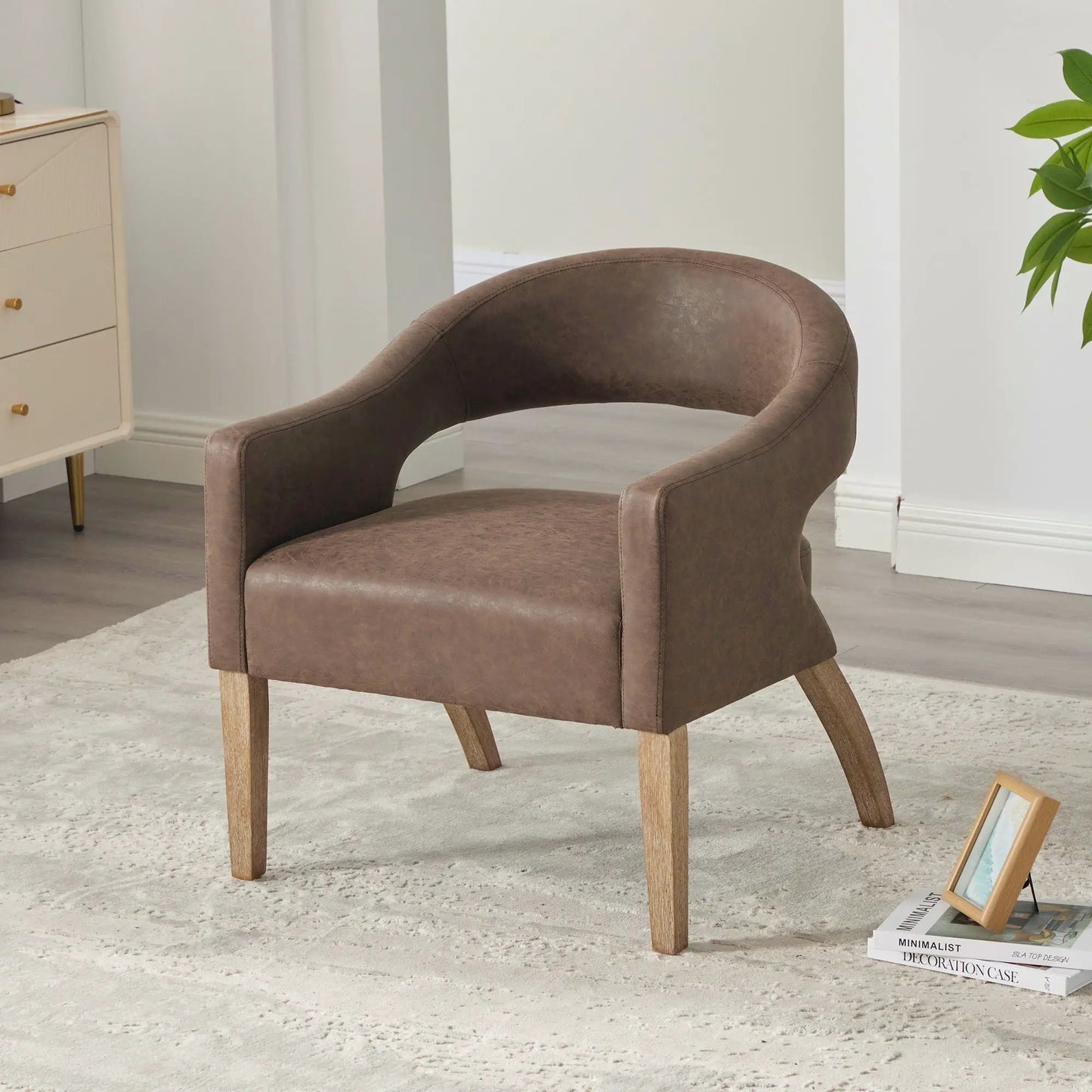 Upholstered open-back armchair with weathered rubberwood legs in brown leatherette on Tampa Home & Garden Store