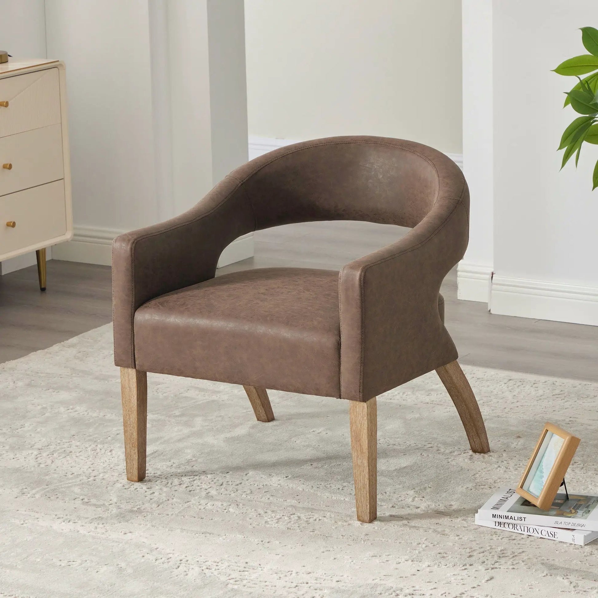 Upholstered open-back armchair with weathered rubberwood legs in brown leatherette on Tampa Home & Garden Store