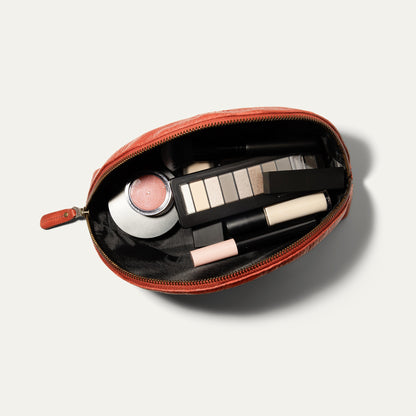 Zip Cosmetic bag by Will Leather Goods in coral leather, open to makeup palette and lipstick on Tampa Home & Garden Store