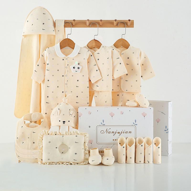 Newborn baby clothes gift box set in beige star print with bodysuits, hat, booties, bag on Tampa Home & Garden Store