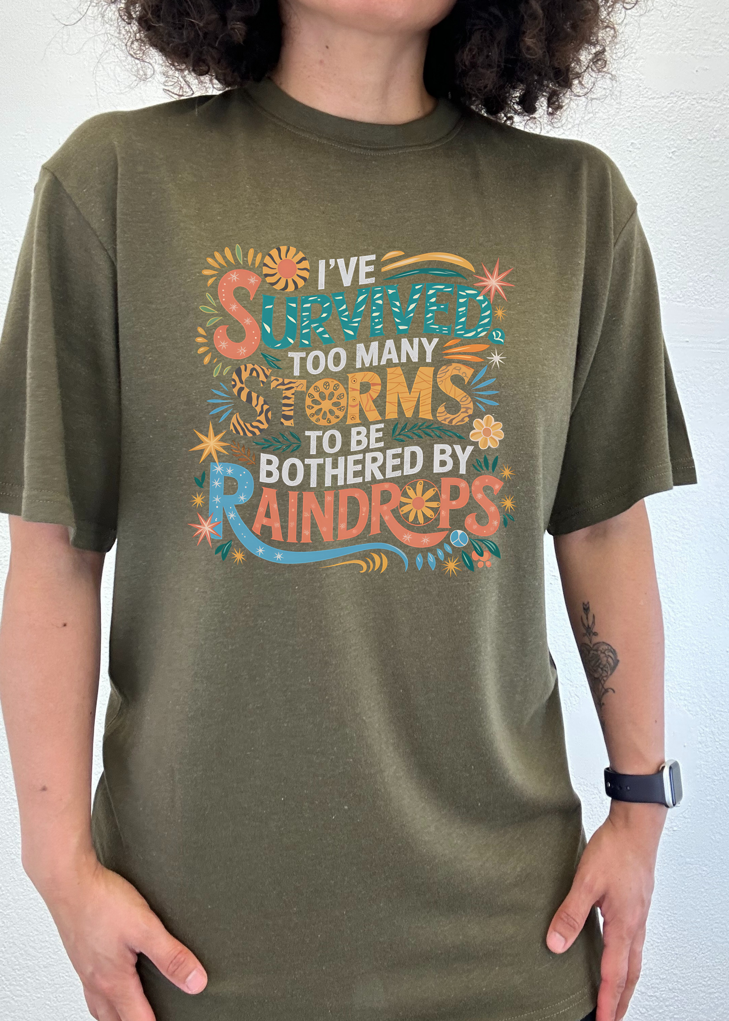 Bamboo/Cotton graphic tee in olive green with I've Survived Too Many Storms to Be Bothered by Rain Drops Spun Bamboo on Tampa Home & Garden Store