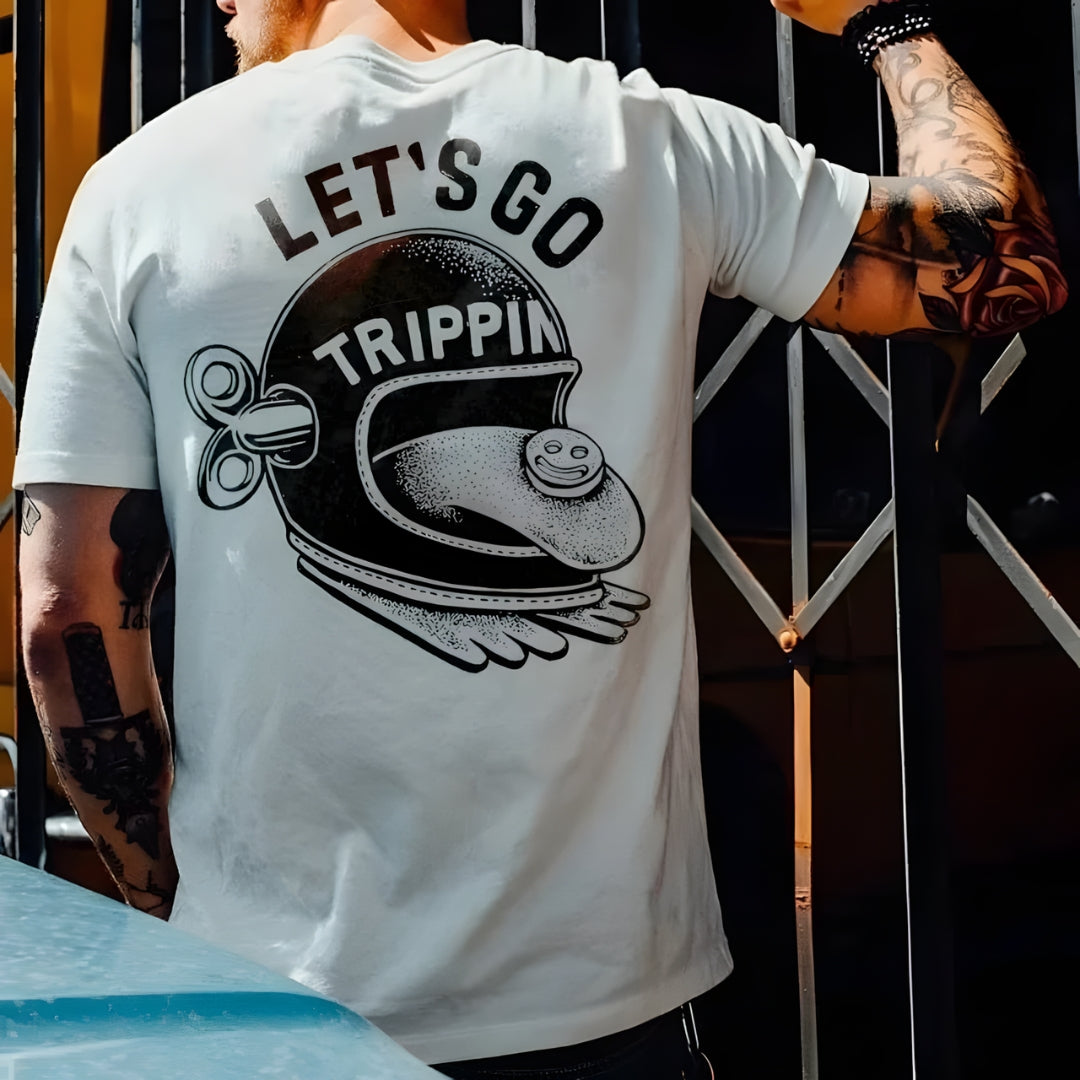 White cotton graphic T-shirt with helmet and tongue LET'S GO TRIPPIN by BikerZoneZ on Tampa Home & Garden Store