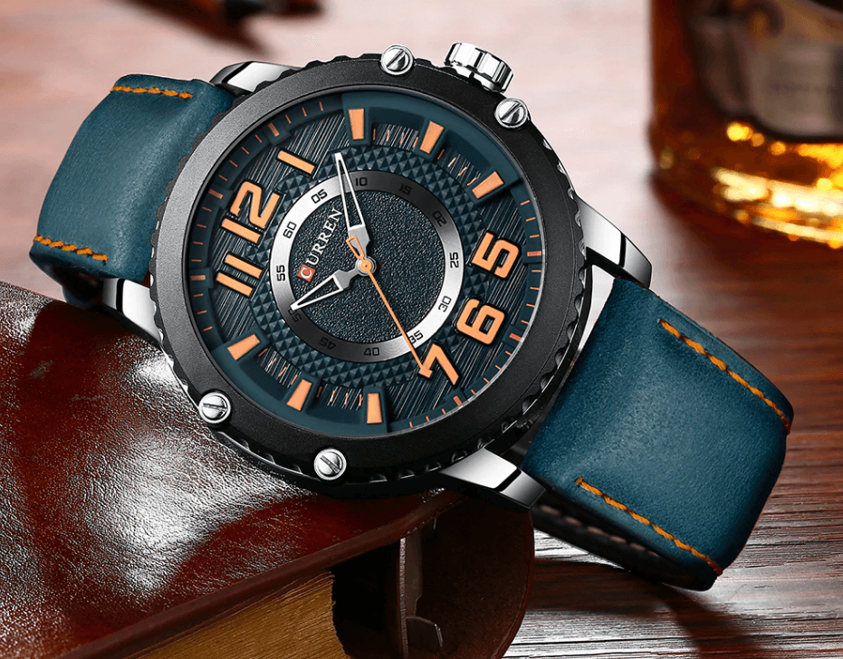 Men's Stevvex waterproof sport watch with blue leather strap and large orange numerals on Tampa Home & Garden Store
