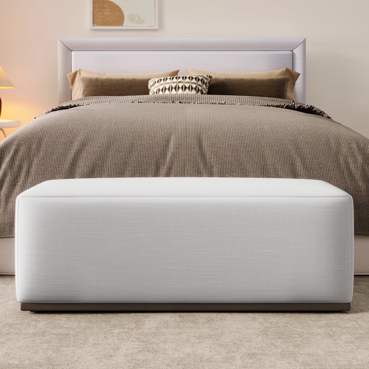 Simple and Elegant Footstool Bench in white upholstery with a dark wood base at end of bed on Tampa Home & Garden Store