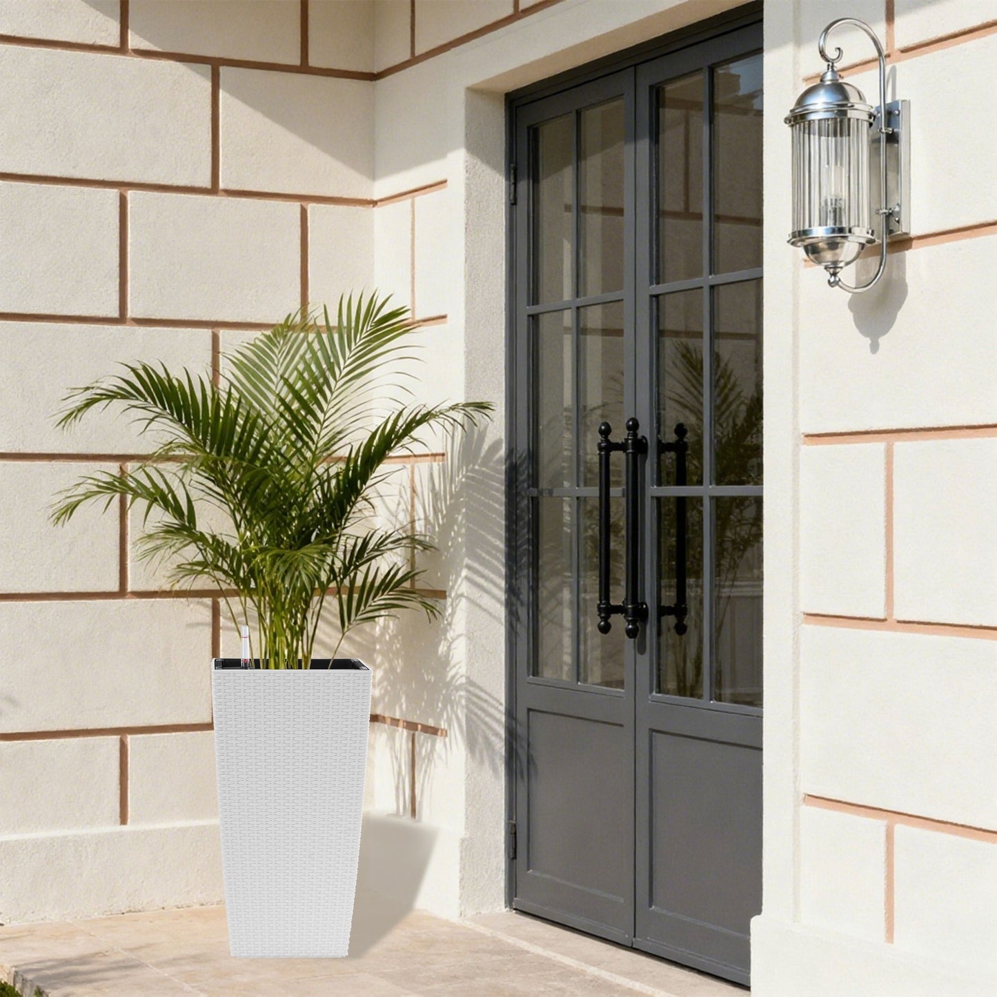 Indoor Outdoor Planter With Automatic Watering System white wicker tall planter beside entry on Tampa Home & Garden Store