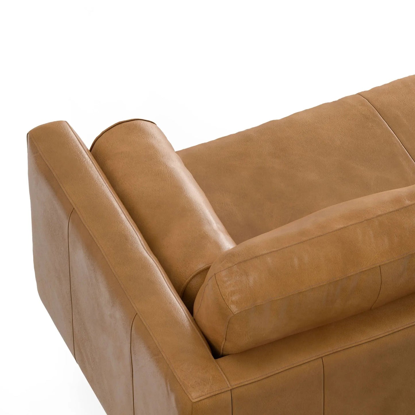 Morrison upholstered stationary sectional sofa in tan leather with visible stitching on Tampa Home & Garden Store