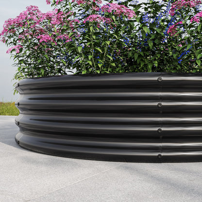 Planters on a car roof rack with pink and blue flowers on Tampa Home & Garden Store