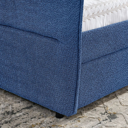 Upholstered blue daybed with 2 drawers, textured fabric and white quilted bedding visible on Tampa Home & Garden Store
