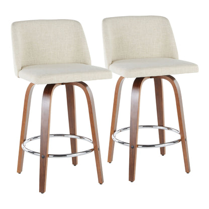 Pair of mid-century modern counter stools with beige padded seats and backs, curved wood legs, chrome footrests on Tampa Home & Garden Store