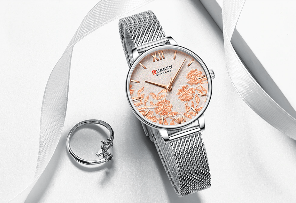 Womens watch with peach floral decoupage dial and silver mesh band Curren logo; ring nearby on Tampa Home & Garden Store