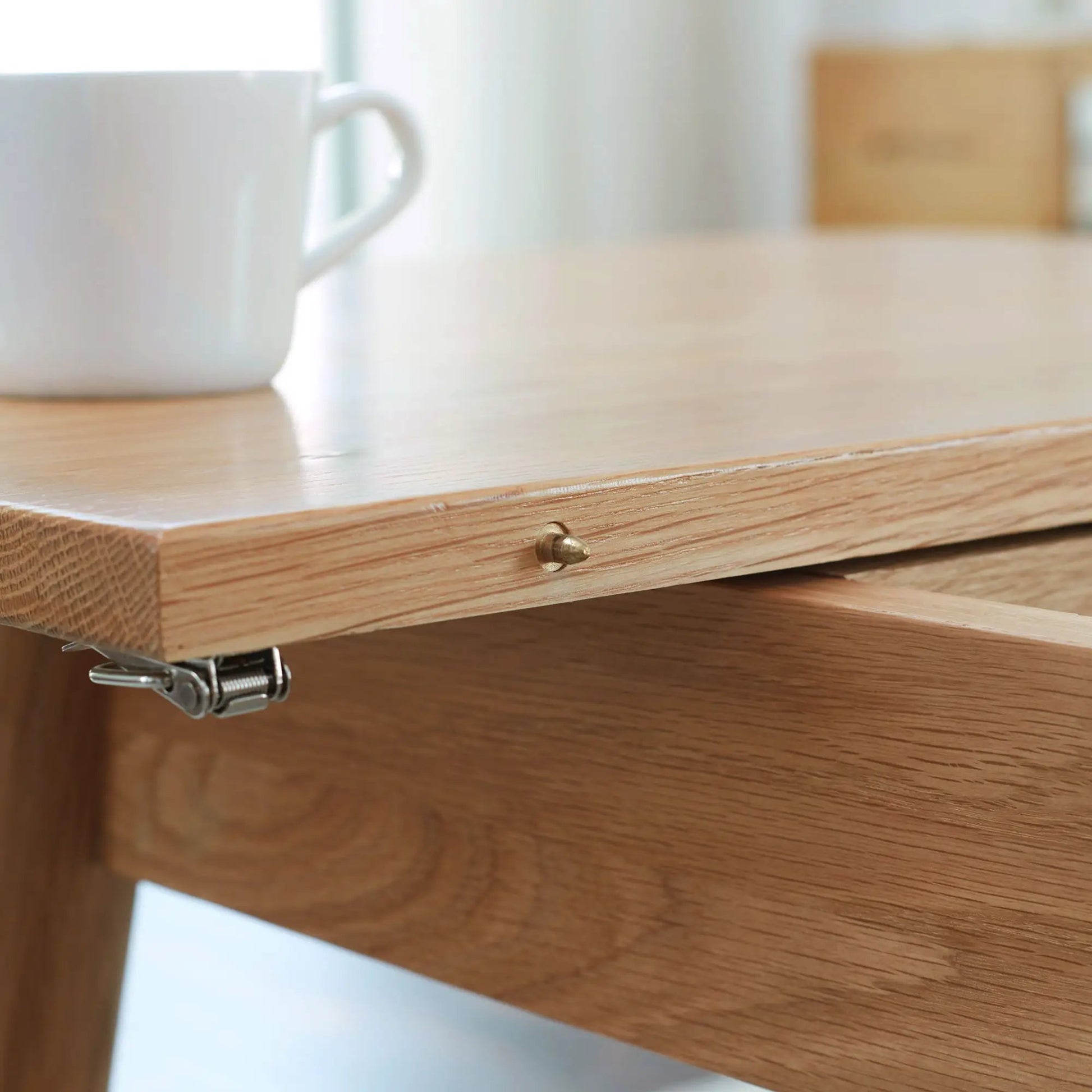 Dining table round corner wood top with visible extension hardware under edge on Tampa Home & Garden Store