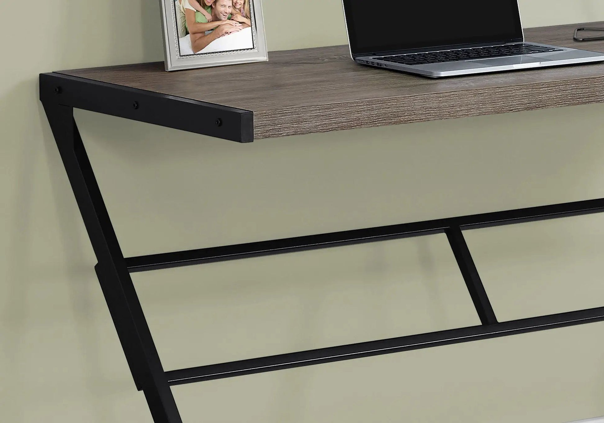 Computer desk with wood finish top and black metal frame; laptop and photo frame on desk on Tampa Home & Garden Store
