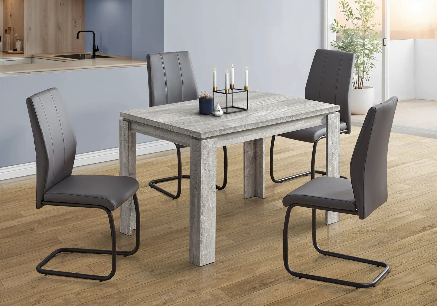 Rectangular small dining table set for four in weathered gray wood with gray upholstered chairs on Tampa Home & Garden Store