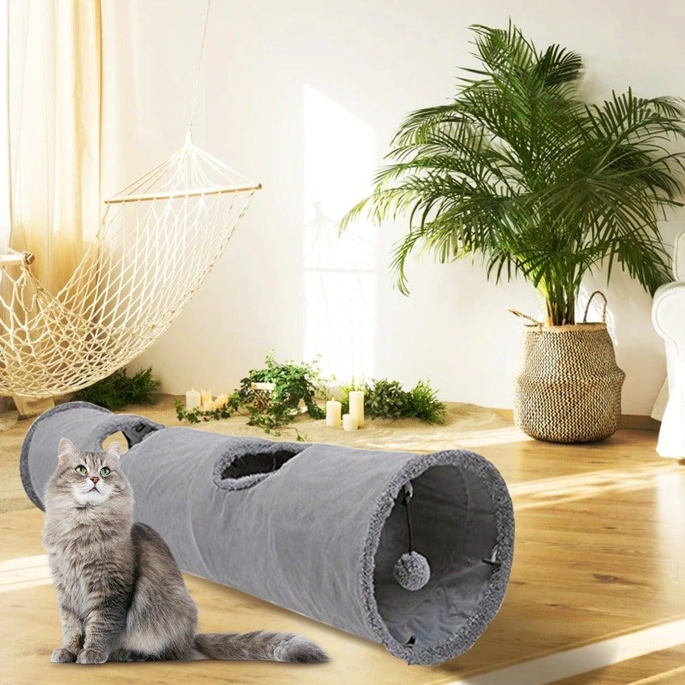 Stevvex foldable cat tunnel with multiple holes, gray fabric collapsible indoor play tube for cats; cat beside on Tampa Home & Garden Store