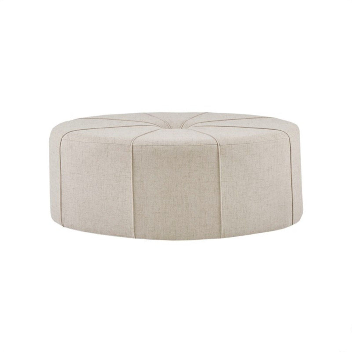 Beige round cocktail ottoman by HouseOfZazla, upholstered with stitched panel top on Tampa Home & Garden Store