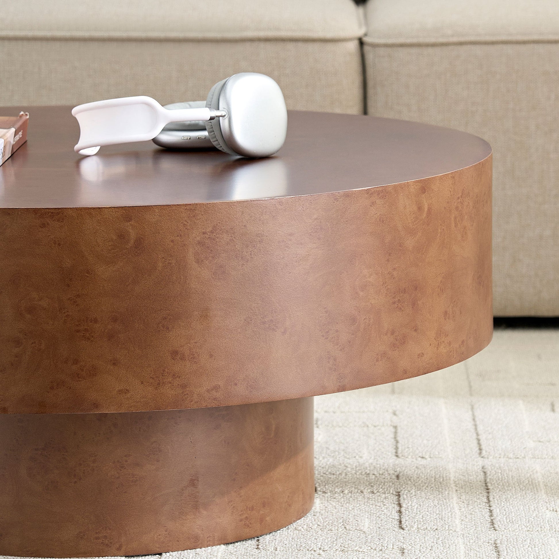 31.49'' faux burl wood round coffee table with pedestal, white headphones on top on Tampa Home & Garden Store