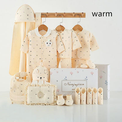 Newborn cream beige star-pattern gift set with three onesies and accessories in a gift box on Tampa Home & Garden Store