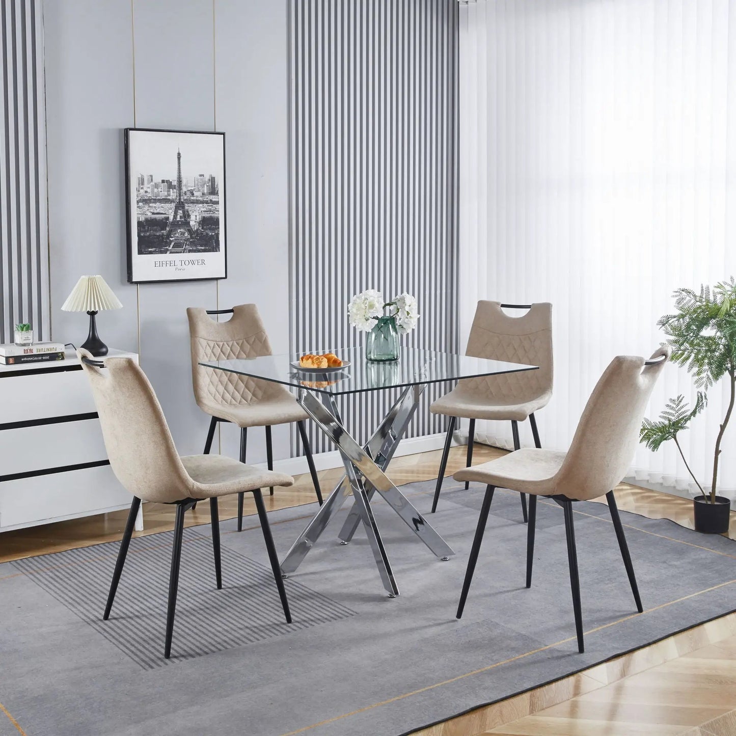 Dining table with cross metal legs and tempered glass top in a modern space-saving design on Tampa Home & Garden Store