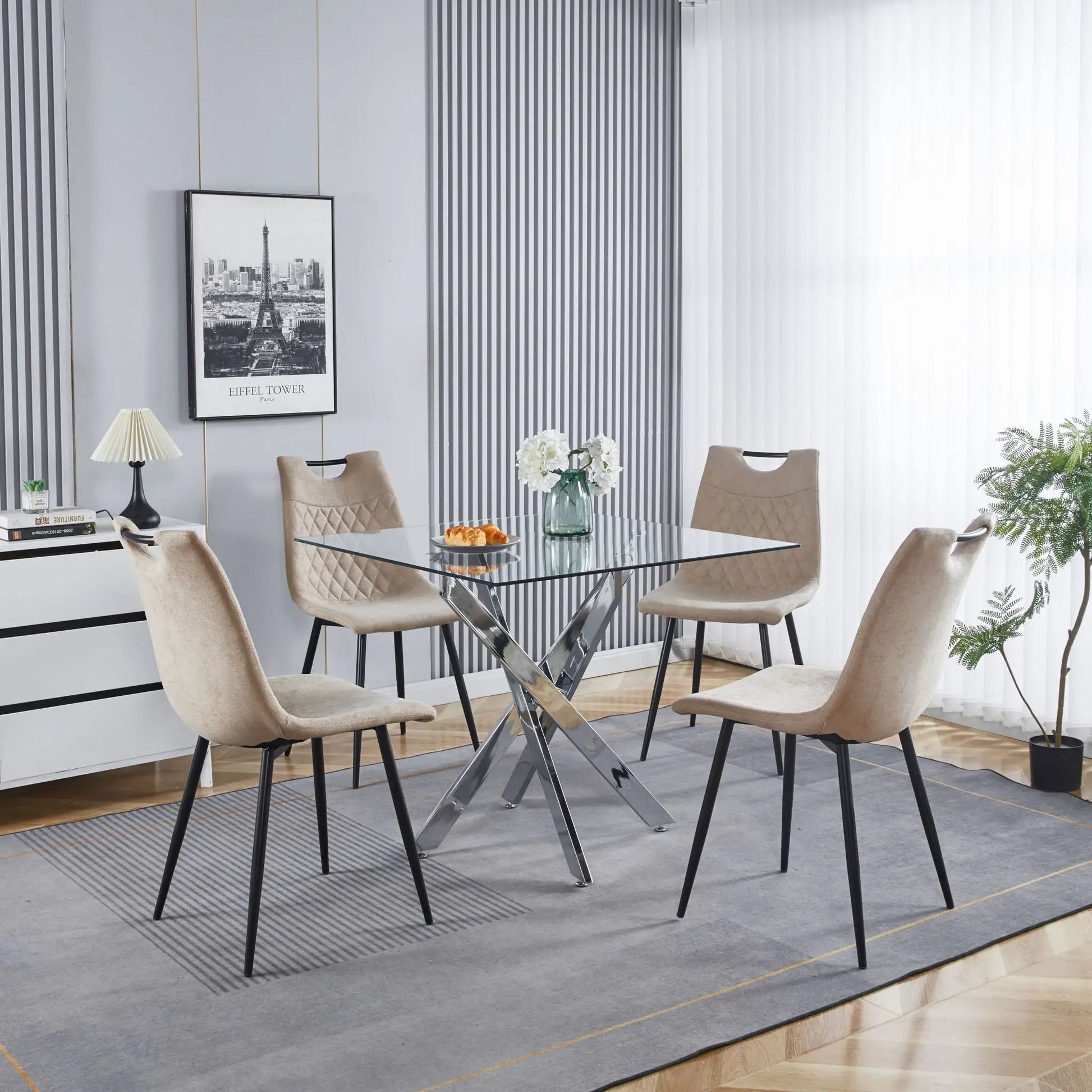 Dining table with cross metal legs and tempered glass top in a modern space-saving design on Tampa Home & Garden Store