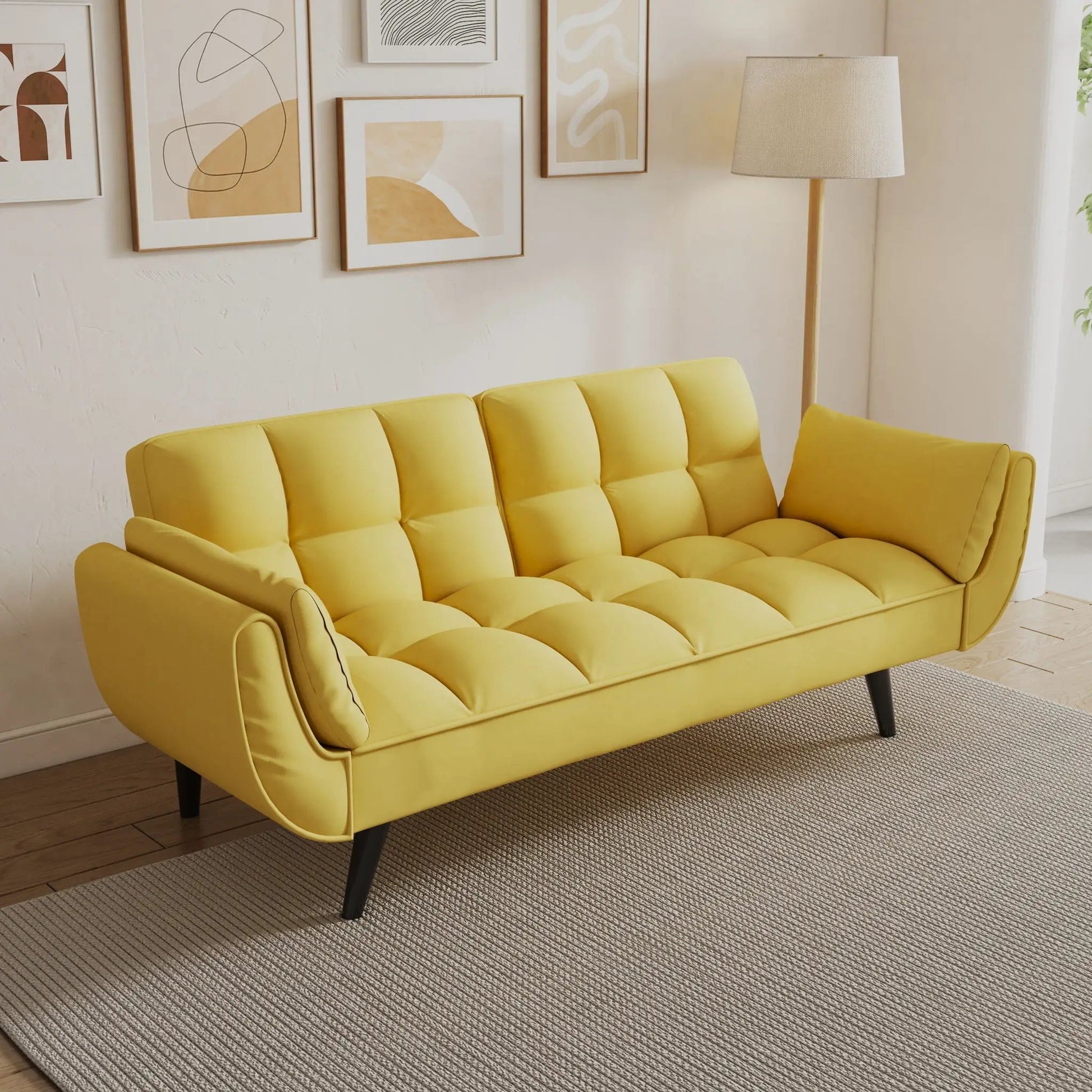 Yellow tufted sofa with two armrests and dark legs in a bright living room on Tampa Home & Garden Store