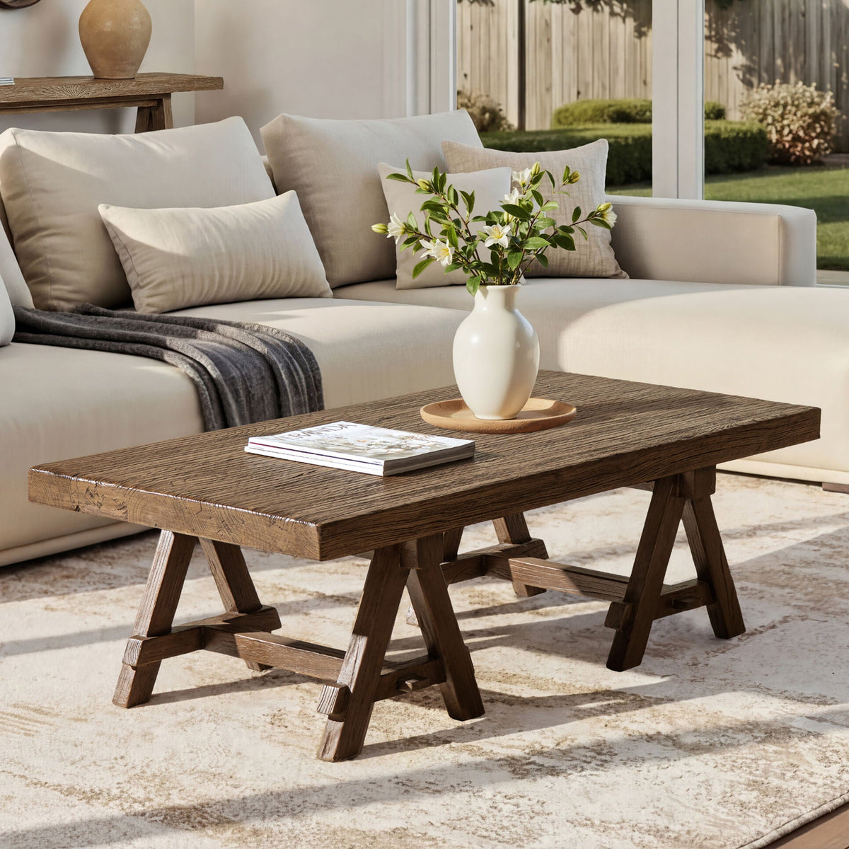 Trestle coffee table in dark reclaimed elm with rugged grain and trestle legs on Tampa Home & Garden Store