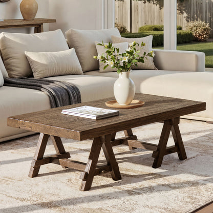Trestle coffee table in dark reclaimed elm with rugged grain and trestle legs on Tampa Home & Garden Store