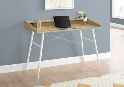 Computer desk in natural wood finish with built-in storage shelves and white legs, laptop on top on Tampa Home & Garden Store