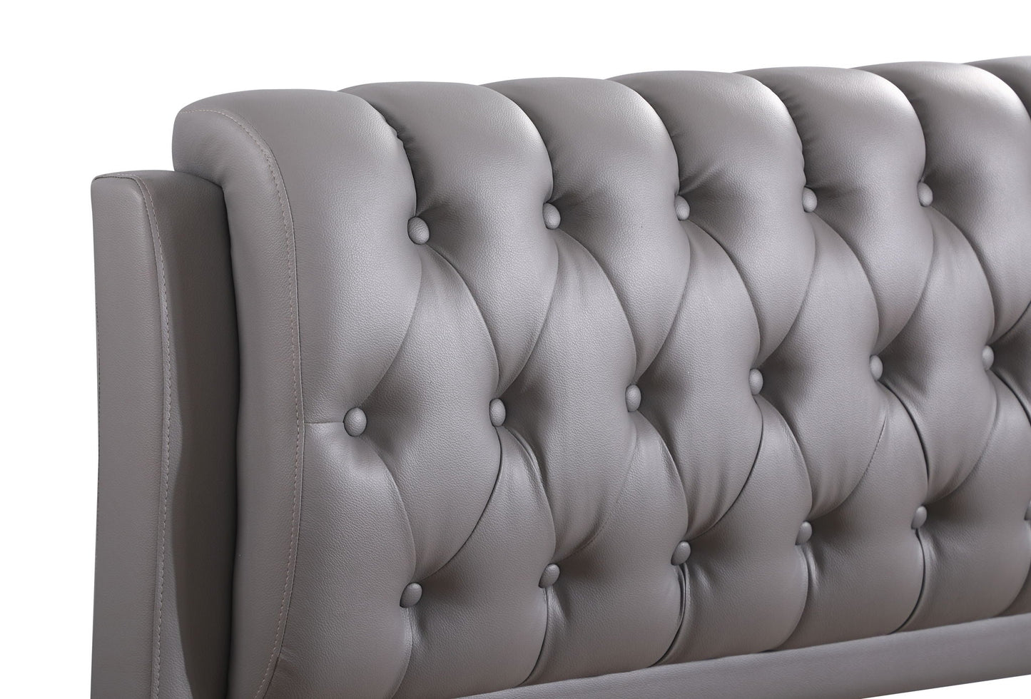 Tufted upholstered bed headboard in gray faux leather with deep button tufting on Tampa Home & Garden Store