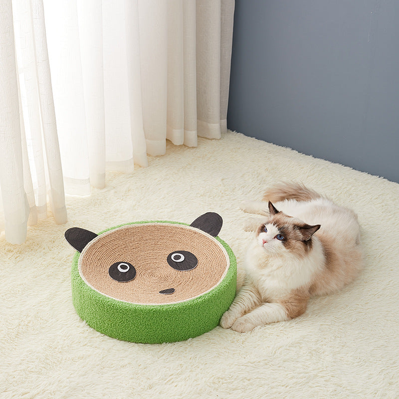 Round green cat scratcher with panda-face top and corrugated cardboard interior, cat lounging nearby on Tampa Home & Garden Store